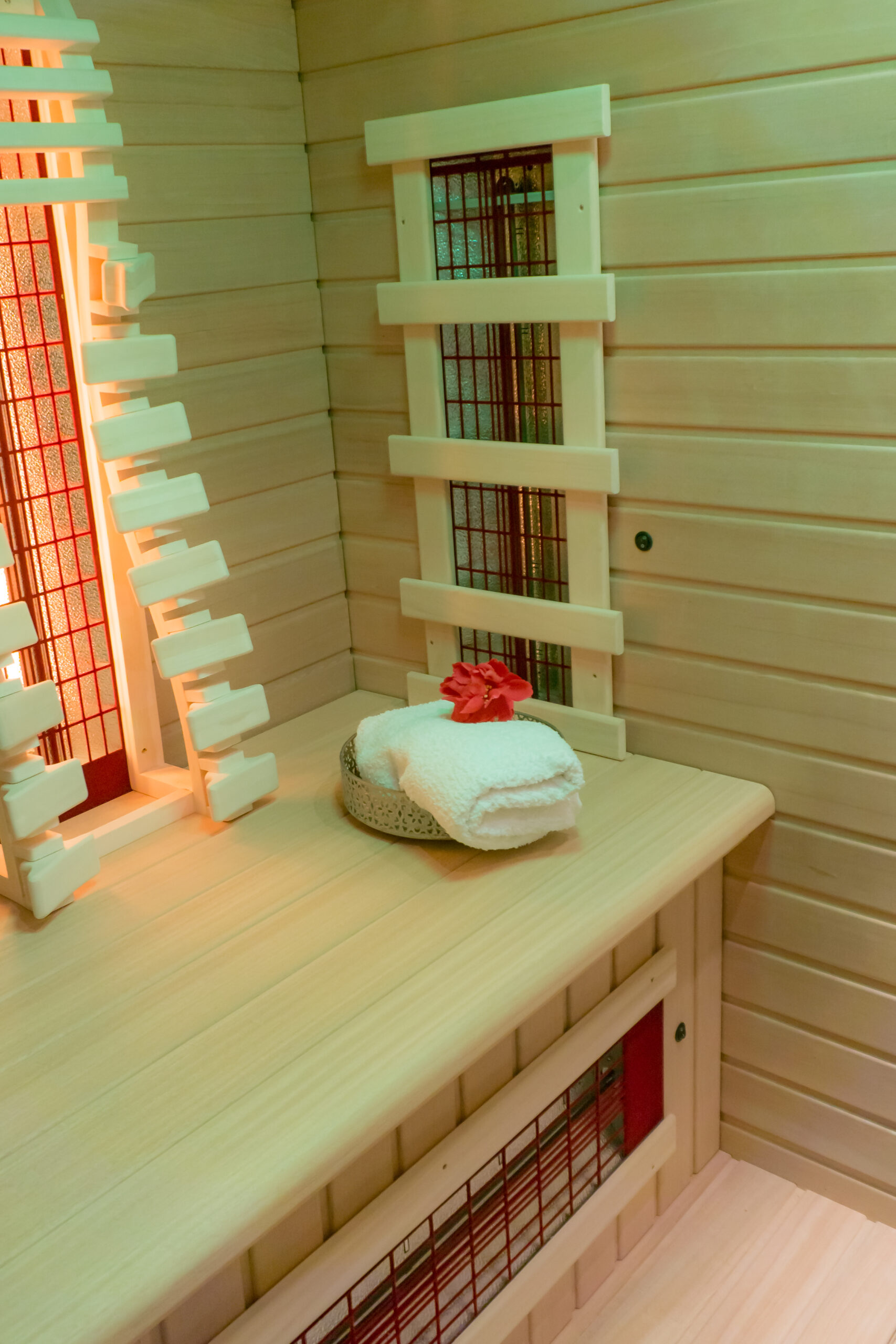 Wooden,Bench,In,An,Infrared,Cabin,With,White,Towel,And